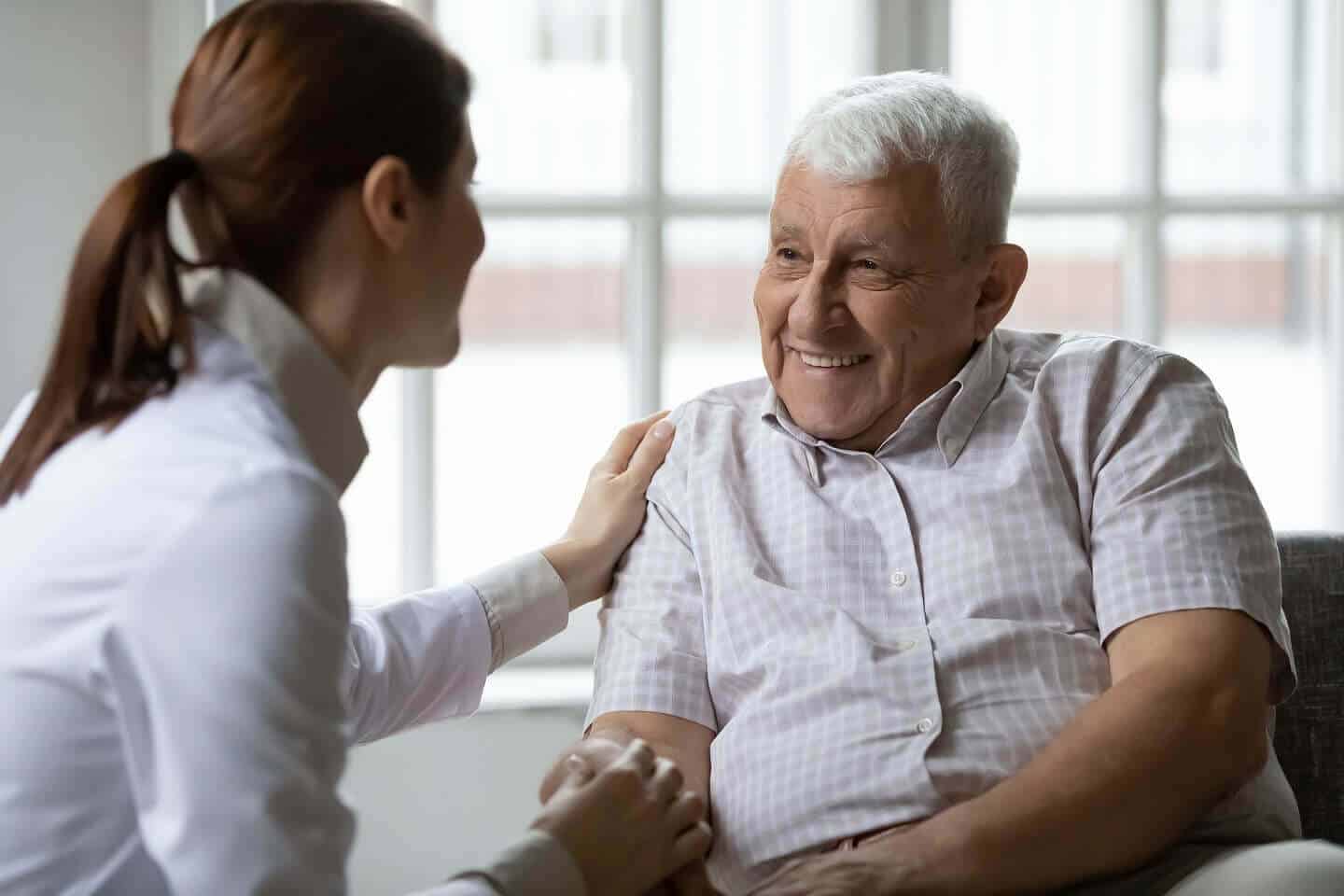 A Volunteer talking with an Elderly Man - ViaQuest Hospice